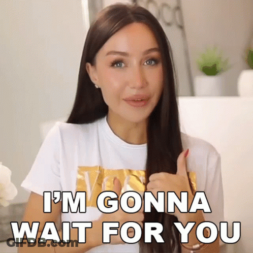 A Woman Giving A Thumbs Up With The Words I 'M Gonna Wait For You Behind Her GIF
