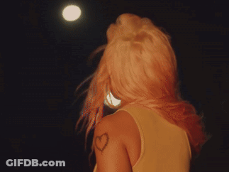 A Woman Has A Heart Tattoo On Her Shoulder GIF