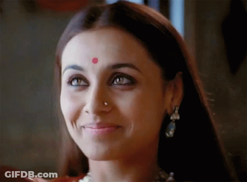 A Woman Has A Red Dot On Her Forehead GIF