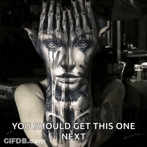 A Woman Has A Tattoo Of A Woman 'S Face On Her Arm GIF