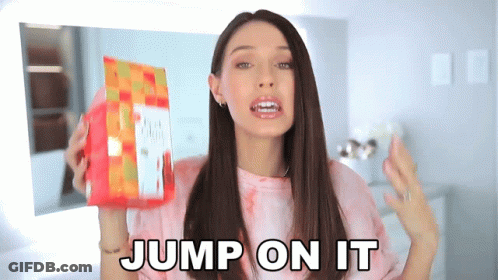 A Woman Holding A Bag Of Food With The Words Jump On It Behind Her GIF