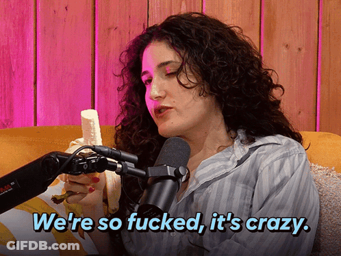 A Woman Holding A Banana In Front Of A Microphone With The Words We 'Re So Fucked It 'S Crazy GIF