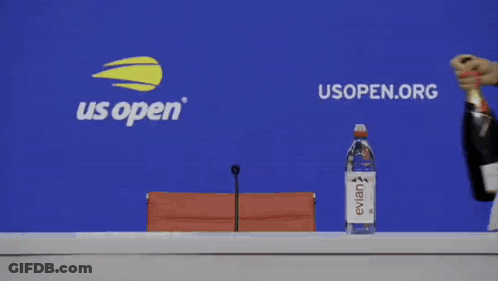A Woman Holding A Bottle Of Evian Water And A Bottle Of Champagne GIF