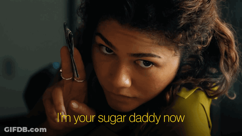 A Woman Holding A Cell Phone With The Words " I 'M Your Sugar Daddy Now " Above Her GIF