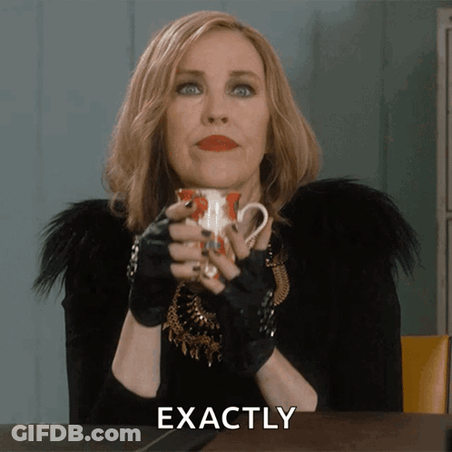 A Woman Holding A Cup Of Coffee With The Word Exactly Above Her GIF