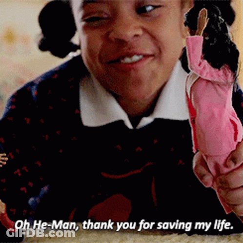 A Woman Holding A Doll With The Words Oh He-Man Thank You For Saving My Life GIF