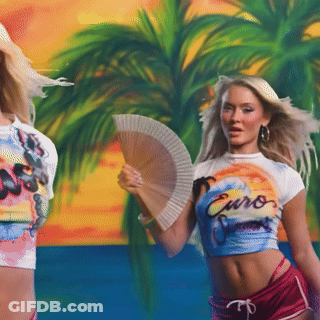 A Woman Holding A Fan Wears A Shirt That Says Euro GIF