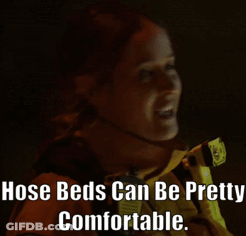 A Woman Holding A Flashlight With The Words Hose Beds Can Be Pretty Comfortable Written Below Her GIF