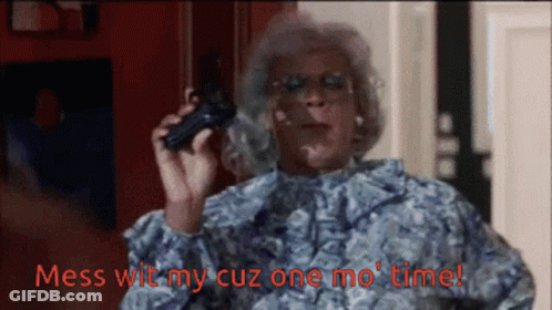 A Woman Holding A Gun With Mess Wit My Cuz One Mo Time Written In Red GIF