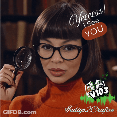 A Woman Holding A Magnifying Glass With The Words Yeeess I See You In The Corner GIF