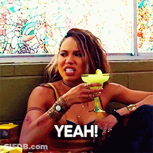 A Woman Holding A Margarita With The Word Yeah Above Her GIF