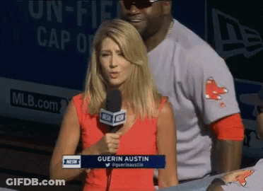 A Woman Holding A Microphone With The Name Guerin Austin On Her Shirt GIF