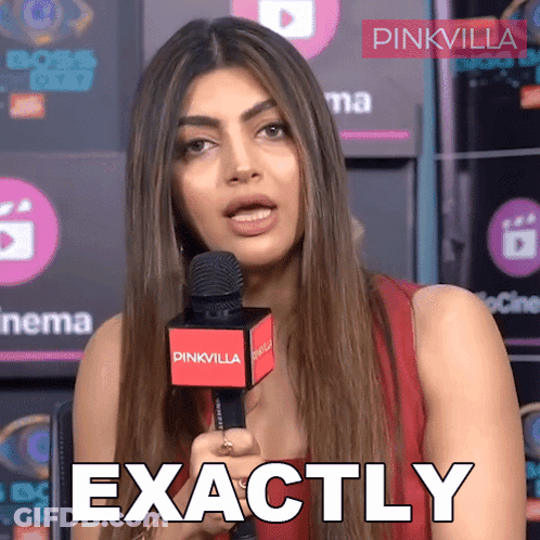 A Woman Holding A Microphone With The Words Exactly Written On It GIF
