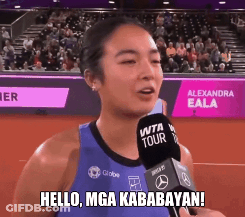A Woman Holding A Microphone With The Words Hello Mga Kababayan Written On It GIF
