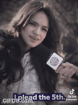 A Woman Holding A Microphone With The Words I Plead The 5Th GIF
