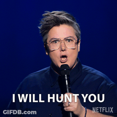 A Woman Holding A Microphone With The Words " I Will Hunt You " On The Bottom GIF