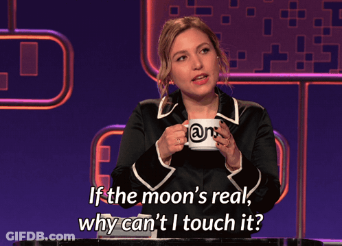 A Woman Holding A Mug That Says ' @N ' On It GIF