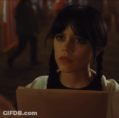 A Woman Holding A Piece Of Paper That Says " I Prefer Spooky " GIF