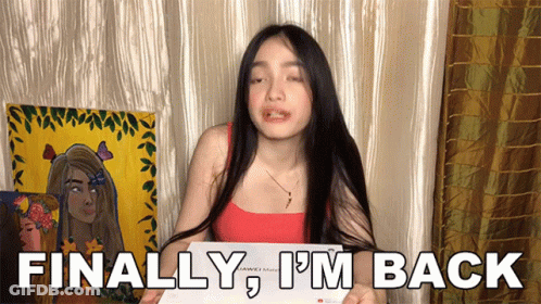 A Woman Holding A Piece Of Paper With The Words Finally I 'M Back On It GIF