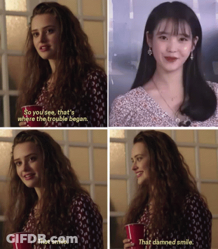 A Woman Holding A Red Cup With The Words " That Smile " On It GIF
