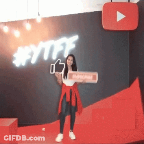 A Woman Holding A Sign That Says Subscribe GIF