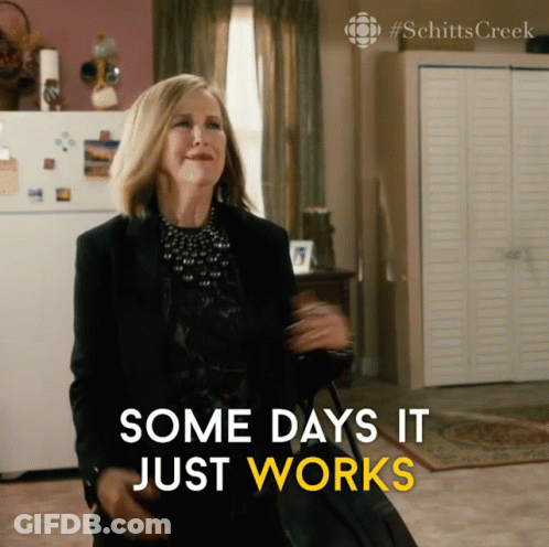 A Woman Holding A Suitcase With The Words Some Days It Just Works Below Her GIF