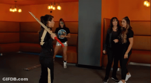 A Woman Holding A Sword With The Words " Shida Later " On The Bottom GIF