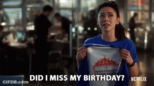 A Woman Holding A T-Shirt That Says Did I Miss My Birthday GIF