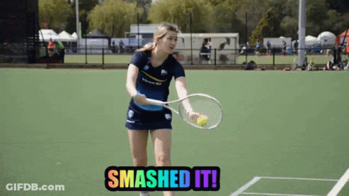 A Woman Holding A Tennis Racquet On A Tennis Court With The Words Smashed It GIF