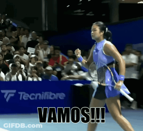 A Woman Holding A Tennis Racquet With Vamos Written On The Bottom GIF