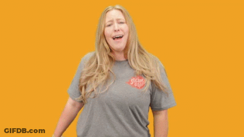 A Woman Holding A Unicorn Sticker With The Words You 'Re A Unicorn GIF