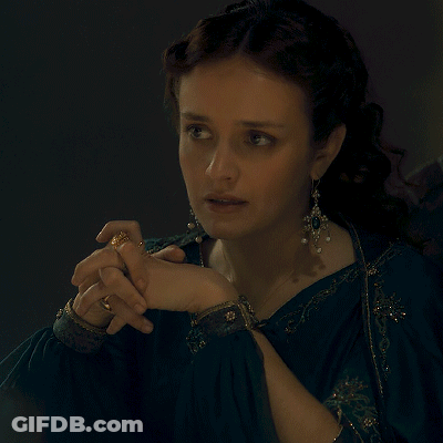 A Woman Holding A Wine Glass With The Words Of Course Written Below Her GIF
