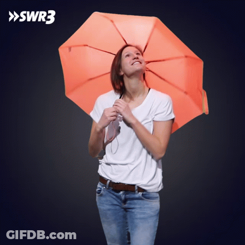 A Woman Holding An Orange Umbrella With Swr3 Written On The Bottom GIF
