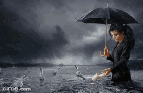 A Woman Holding An Umbrella Is Standing In The Rain GIF