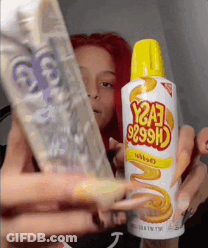 A Woman Holds A Bottle Of Y2a3 9299H GIF