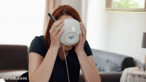 A Woman Holds A Bowl With Oslo Written On It GIF