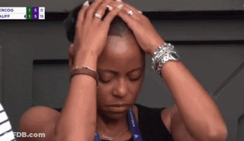 A Woman Holds Her Head With Her Eyes Closed In Front Of A Scoreboard That Says Ercog Auff GIF