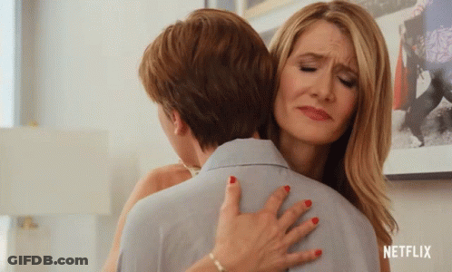 A Woman Hugging Another Woman With A Netflix Logo On The Bottom Right GIF