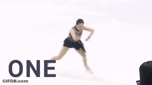 A Woman Ice Skating With The Words Slay One Must Above Her GIF