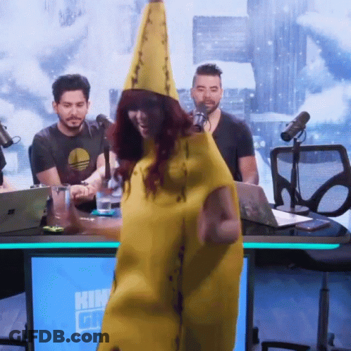 A Woman In A Banana Costume Stands In Front Of A Blue Screen That Says ' Kin ' GIF