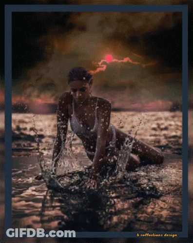 A Woman In A Bathing Suit Is Kneeling In The Water With A Sunset In The Background GIF