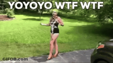 A Woman In A Bathing Suit Is Standing On A Sidewalk In Front Of A Grassy Yard . GIF