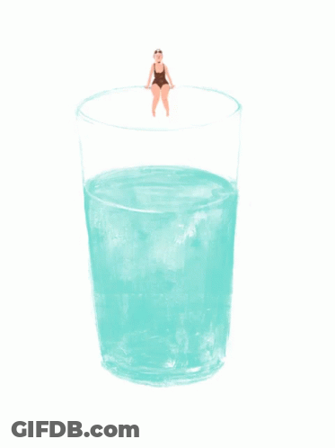 A Woman In A Bathing Suit Sits On The Edge Of A Glass Of Water GIF