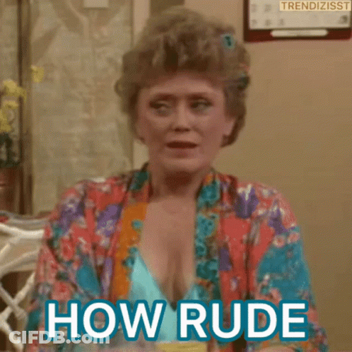 A Woman In A Bathrobe Is Sitting At A Table And Says How Rude . GIF