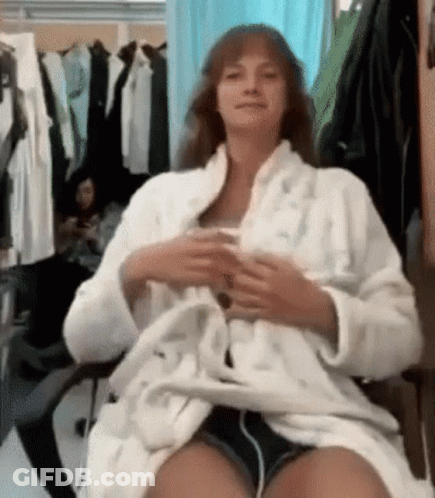 Woman In Bathrobe Sitting With Coffee GIF
