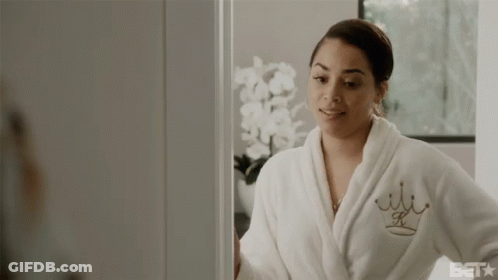 A Woman In A Bathrobe Is Smiling And Says Handle That Thing Yourself GIF