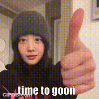 A Woman In A Beanie Is Giving A Thumbs Up . GIF