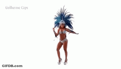 A Woman In A Bikini Is Dancing In A Carnival Costume With Feathers . GIF