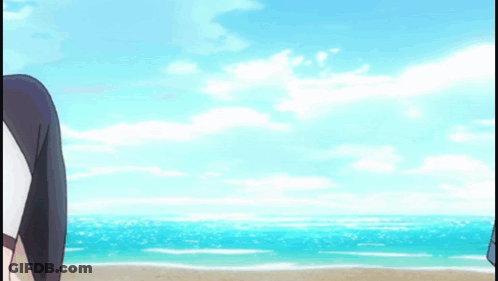 A Woman In A Bikini Is Jumping Into The Water On The Beach . GIF