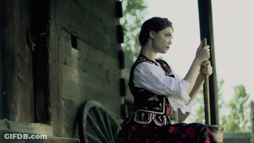 A Woman In A Black And White Dress Has The Number 8 On Her Waist GIF